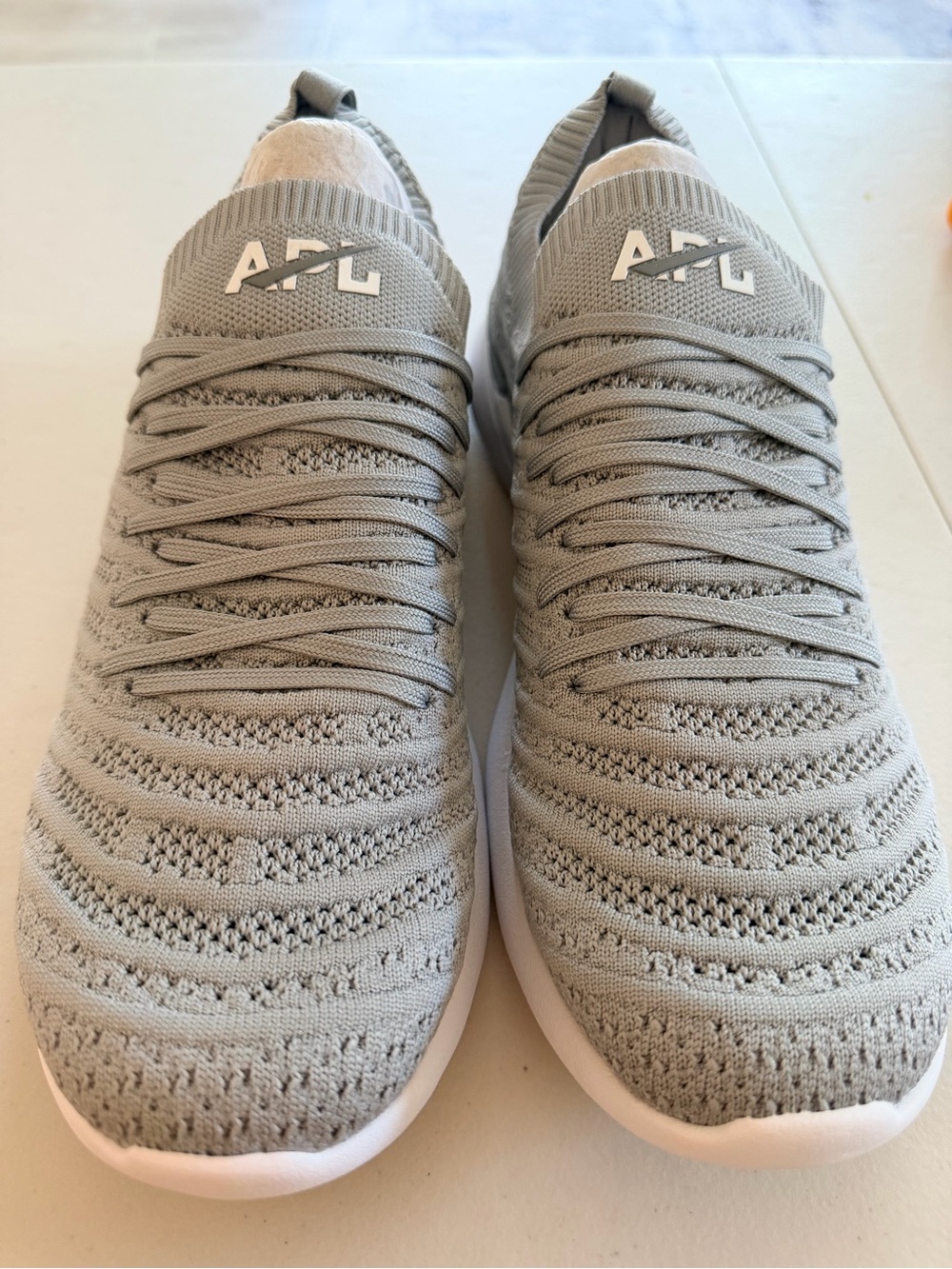 APL women’s Grey Knit Slip-On Sneakers